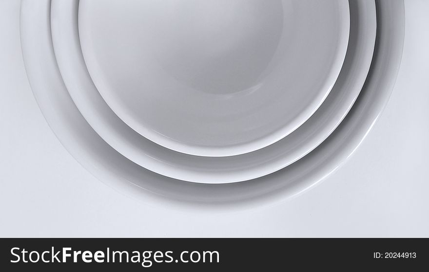 Set of three nestled white bowls