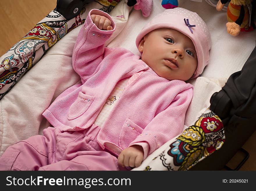 Newborn in baby lying in the carriage/ baby pram. Newborn in baby lying in the carriage/ baby pram