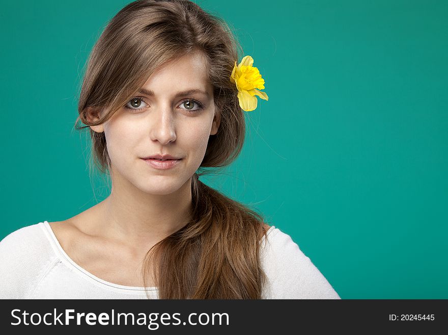 Portrait Of Female With Flower Over The Ear