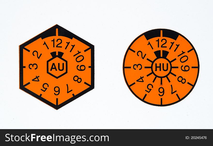 A orange german TUEV-seal and AU-badge