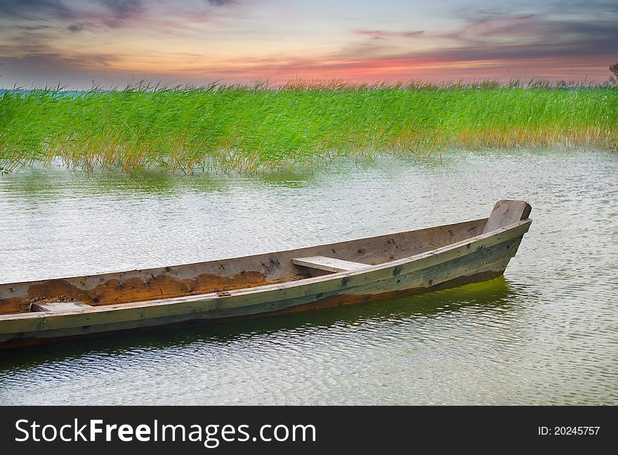 Boat at coast against a coming nearer thunder-storm