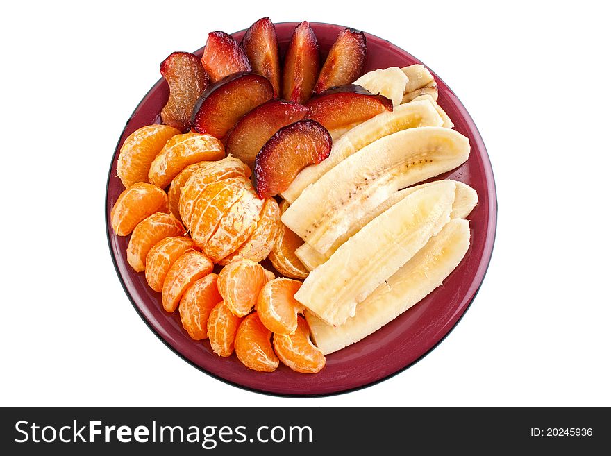 Fruits on dish, mandarine, banana and blumbs, isolated on white. Fruits on dish, mandarine, banana and blumbs, isolated on white.