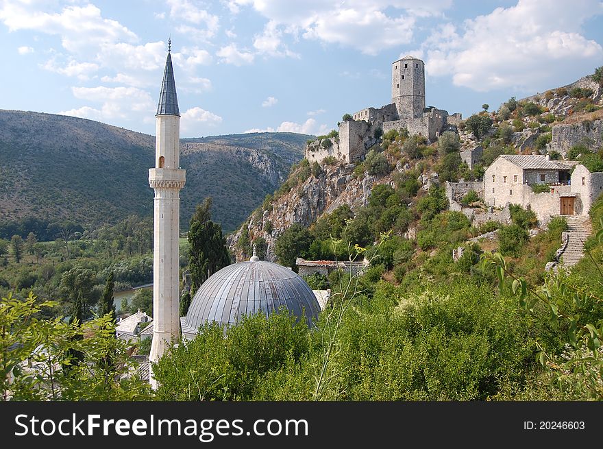 A photograph Pocitelj Town on the Capljina River with mosque and castle, Bosnia and Herzegovina. A photograph Pocitelj Town on the Capljina River with mosque and castle, Bosnia and Herzegovina