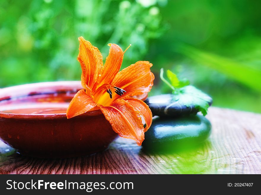 Still life with lily flower and spa stones. soft focus. Still life with lily flower and spa stones. soft focus