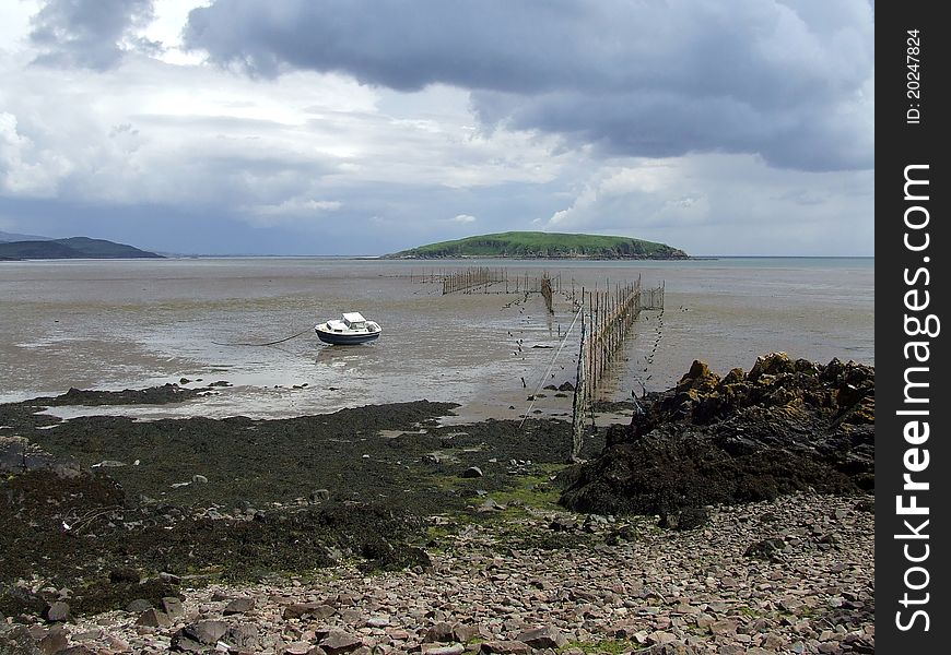 Balcary Fishery looking towards Heston Island, with nets and fishing boat in foreground