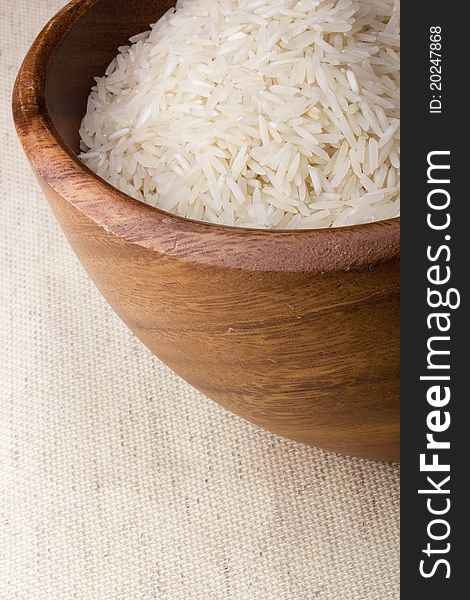 Close-up of white rice in a brown plate.