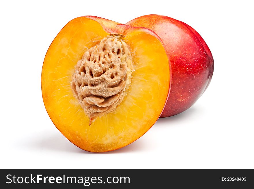 Two nectarines on a white