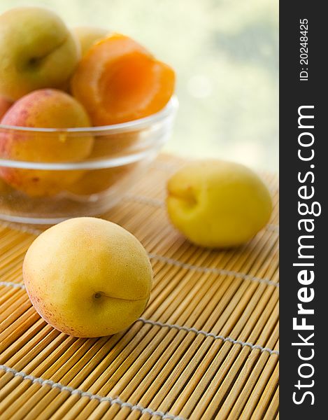 Fresh ripe apricots in plate on table. Fresh ripe apricots in plate on table