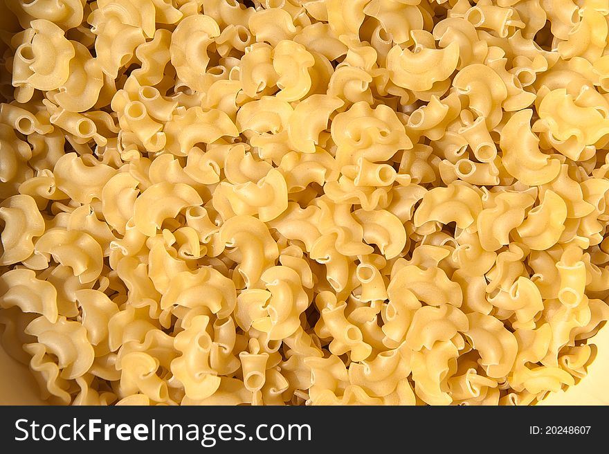 Irregular Shaped Dry Yellow Pasta in a Bowl