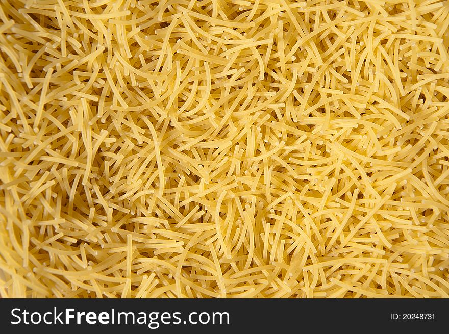 Dry Yellow Short Vermicelli Pasta Background. Dry Yellow Short Vermicelli Pasta Background