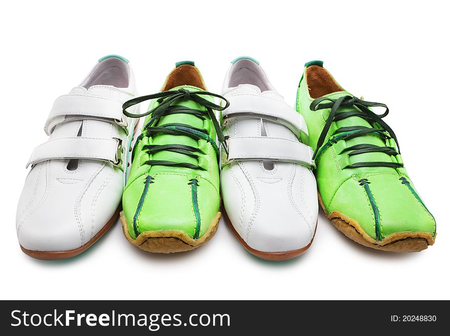 White and green sneakers on white background