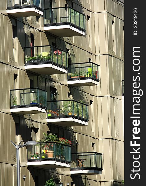 Modern building with pretty flowered balconies. Modern building with pretty flowered balconies