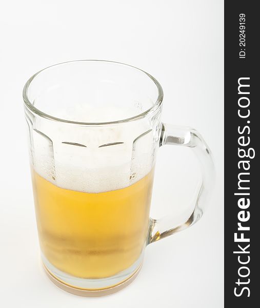 Beer in a mug isolated on white background