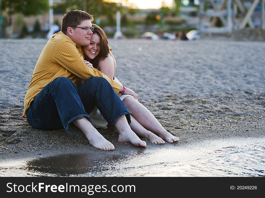 Young Couple By The Water