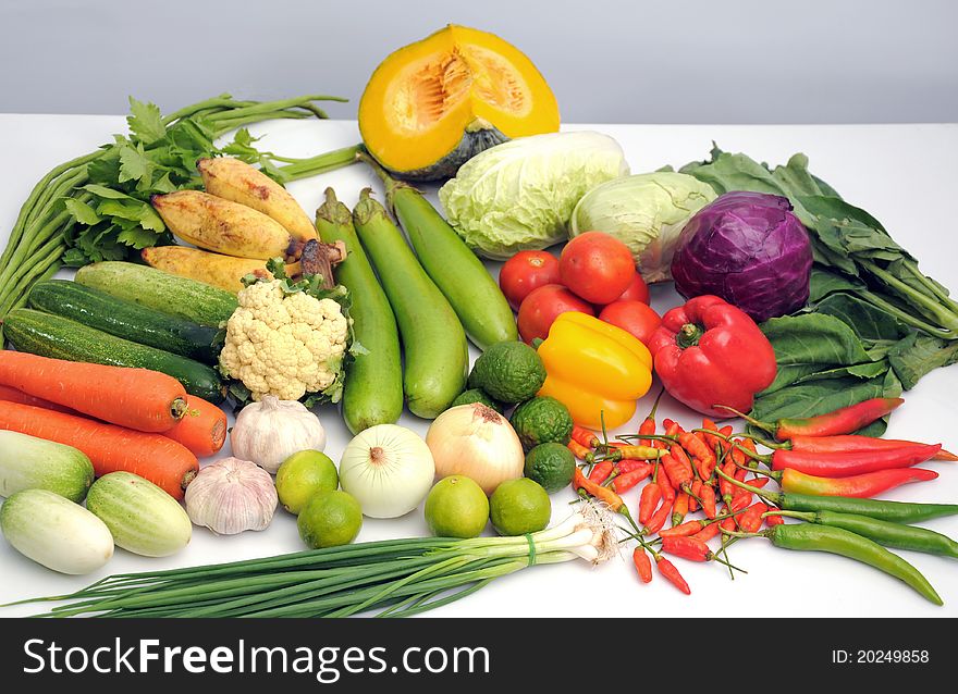 Mixed vegetables on white table isolated