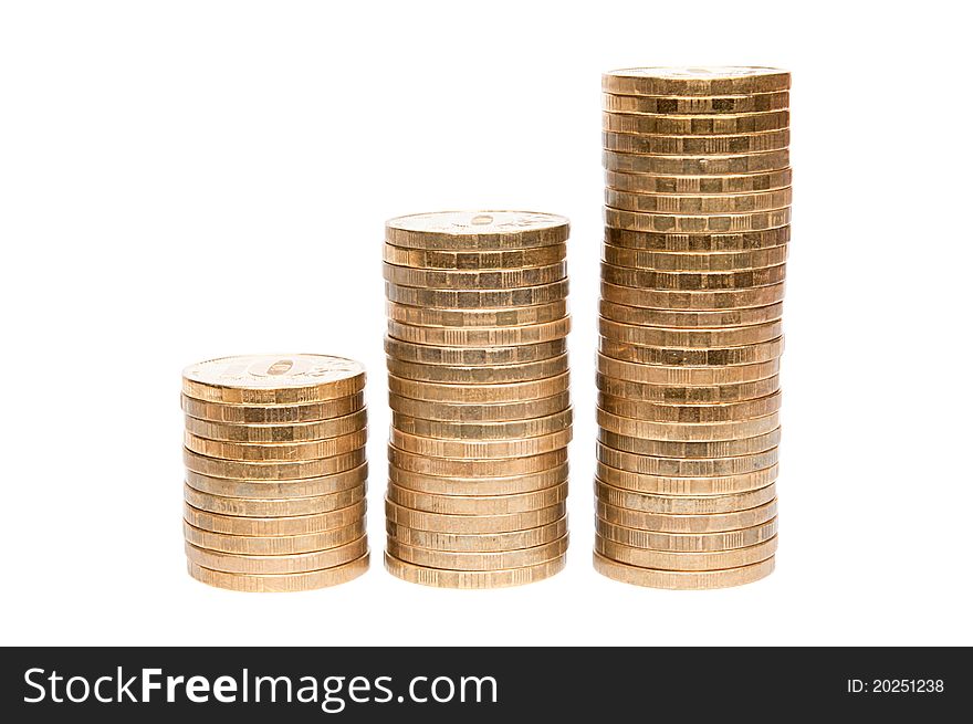 Three columns of coins isolated on white background