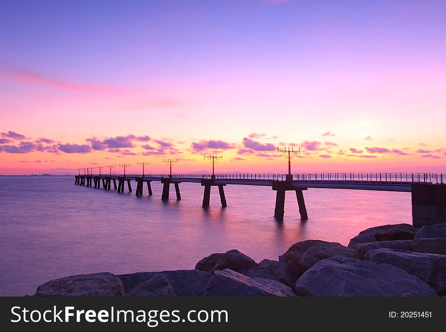 Sunset along the coast with sea stones