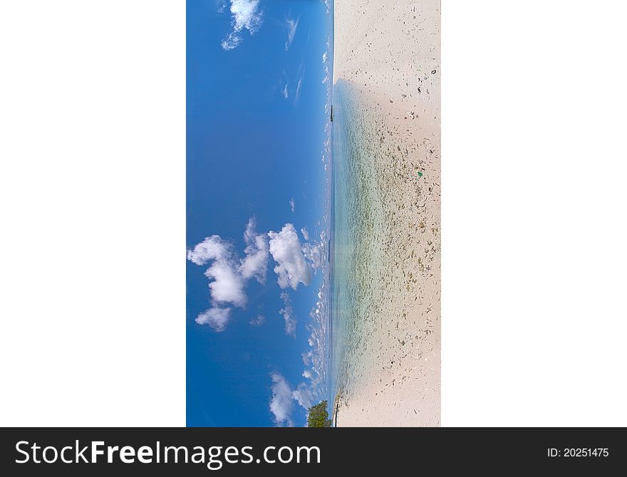 Long combined panaroma of a sandy beach in a tropical island. Long combined panaroma of a sandy beach in a tropical island