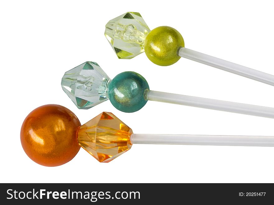 Colorful cocktail picks for small appetizers isolated on white. They are made of 2.5 inch plastic 'toothpick' topped with small decorative beads.