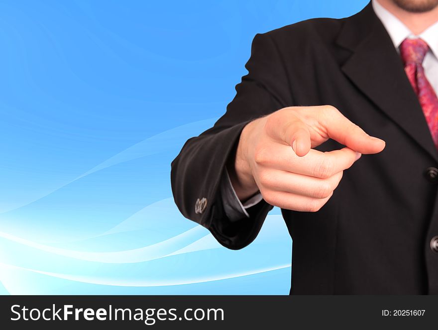 Businessman pointing on soft background. Businessman pointing on soft background