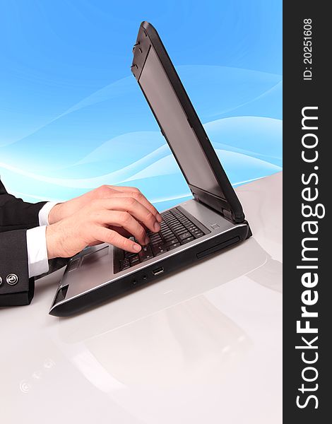 Businessman typing on laptop with binary code on background. Businessman typing on laptop with binary code on background