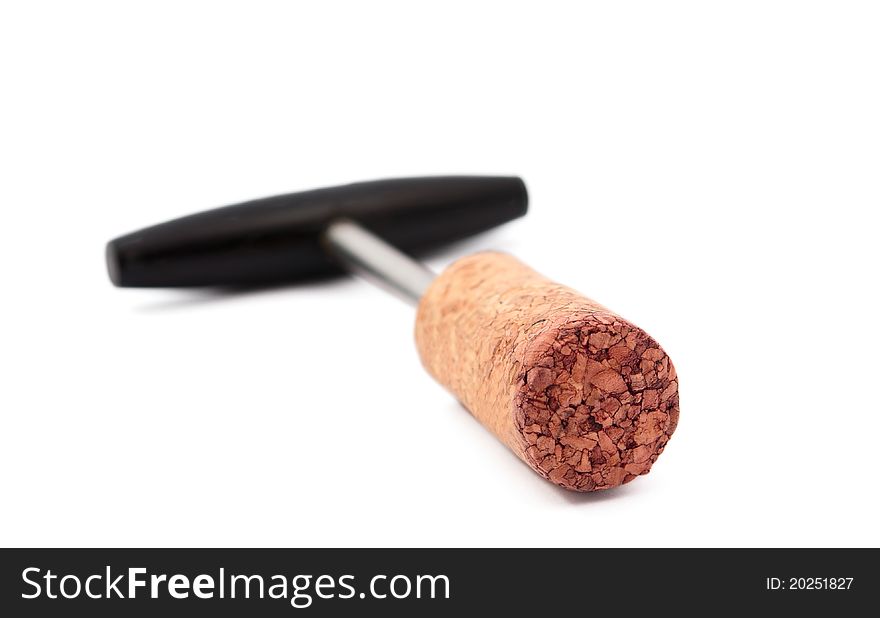 Corkscrew with wine cork on a white background