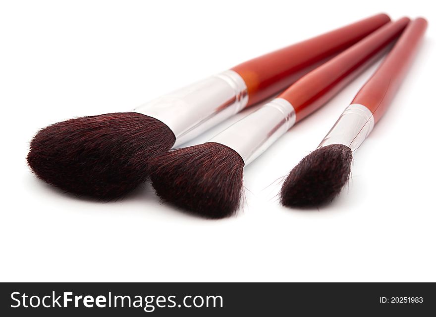 Makeup brushes on a white background