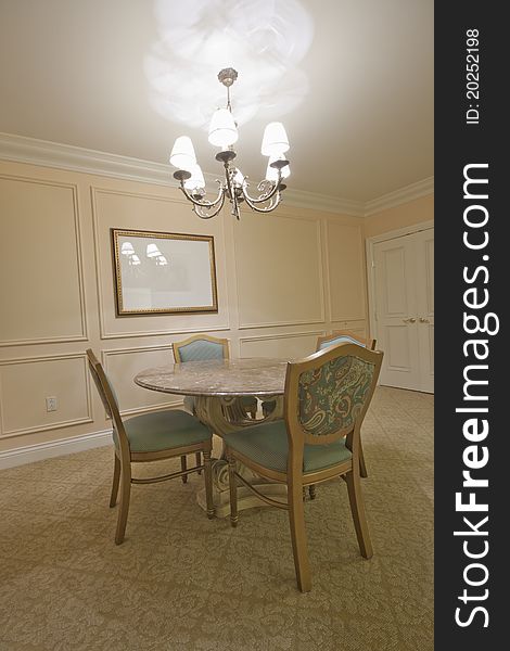 Round Marble Table Surrounded By Chairs