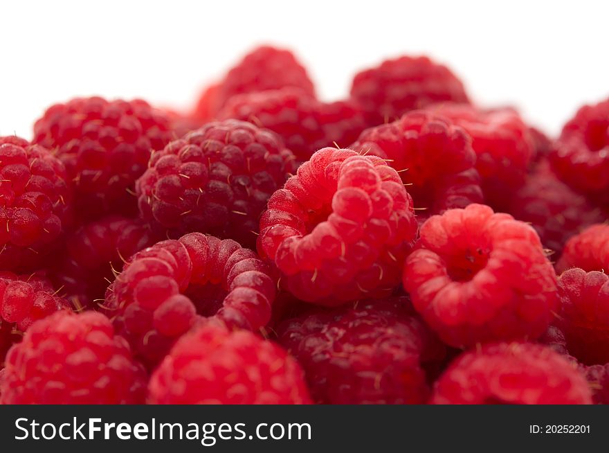 Red raspberries on a white background