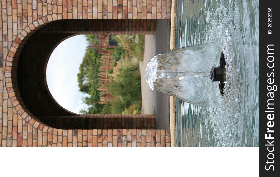 Water fountain with Brick Arch in Background. Water fountain with Brick Arch in Background