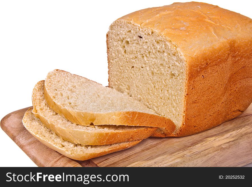 The homestyle white bread on the breadboard. The homestyle white bread on the breadboard.