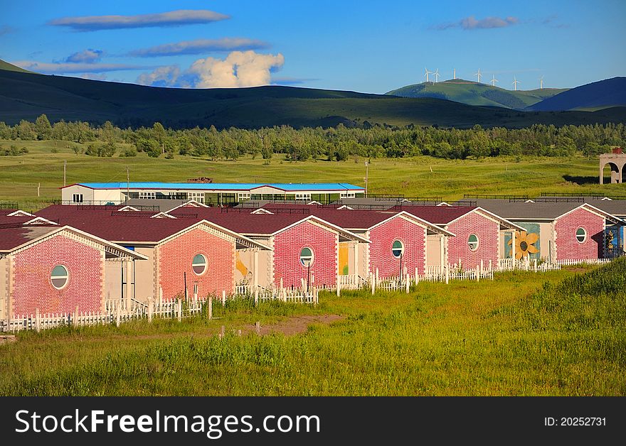 Holiday resort cabins in grassland.