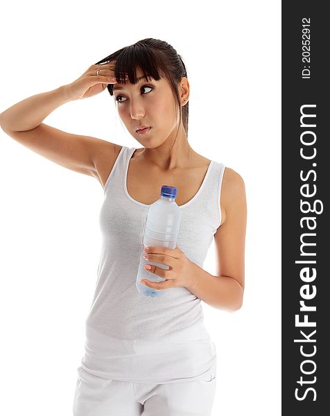 Young exhausted woman holding a bottle of water after workout. Young exhausted woman holding a bottle of water after workout.