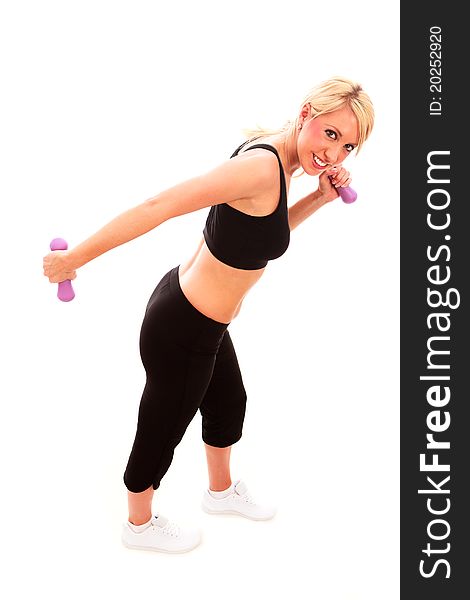 A young female dressed in black exercise clothes performing a tricep kickback exercise