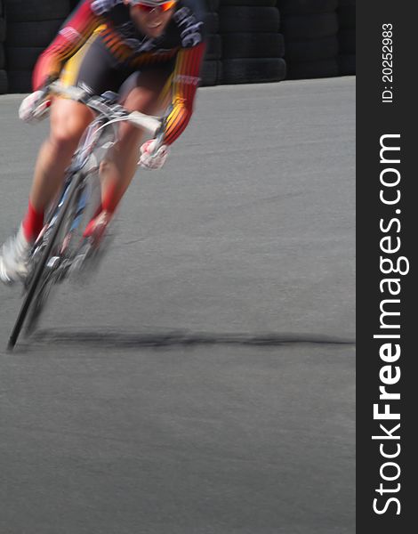 Blurred motion cyclist in a corner. Blurred motion cyclist in a corner