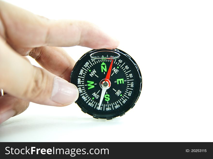 Hand holding a compass isolated on white background