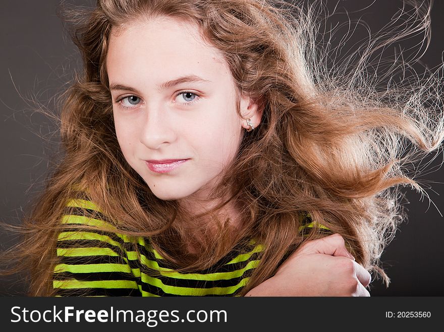 Portrait of beautiful young girl in studio