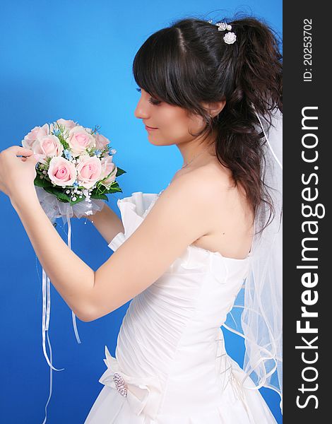 Beautiful bride on a blue background