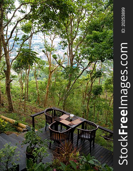 Reclusive cafe table on the terrace in tropical woods. Reclusive cafe table on the terrace in tropical woods