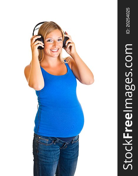 Pregnant woman with headphones isolated on white