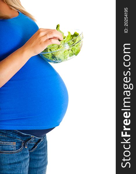 Pregnant woman with vegetables, isolated on white