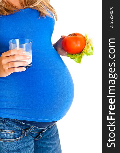 Pregnant woman with vegetables, isolated on white