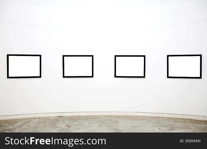 Empty frames on the wall of the gallery. Empty frames on the wall of the gallery