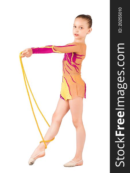 The young gymnast stands with a rope