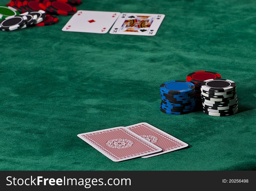 Cards and chips in a Texas hold 'em poker game.