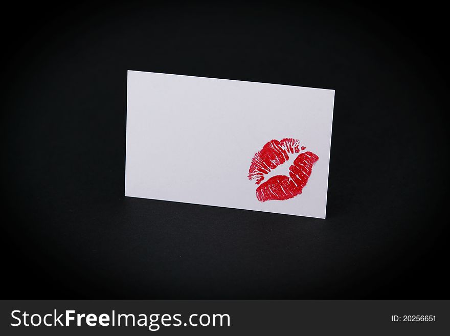 A kiss on a blank business card. A kiss on a blank business card