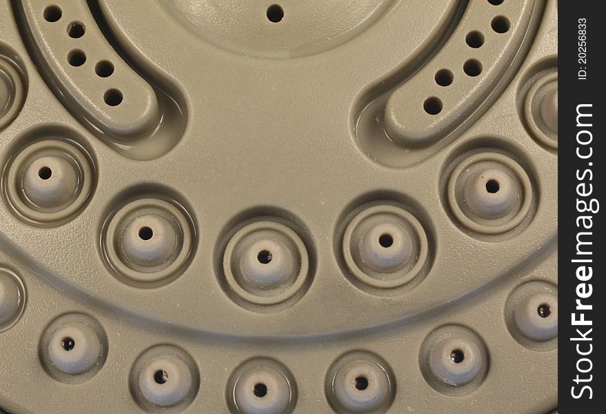 Closeup of a shower head rubber nozzle.