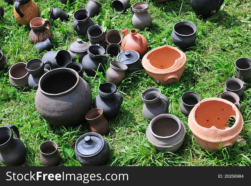 Traditional Lithuanian earthenware pottery on grass