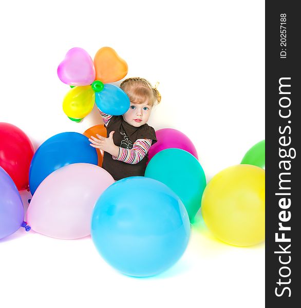 Little girl posing on front of camera with baloons. Little girl posing on front of camera with baloons