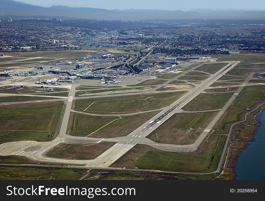 Vancouver Airport in Richmond and mountains. Vancouver Airport in Richmond and mountains